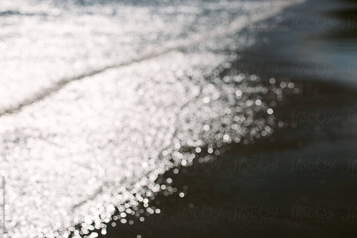 Light sparkling on the ocean. Deliberate blur.