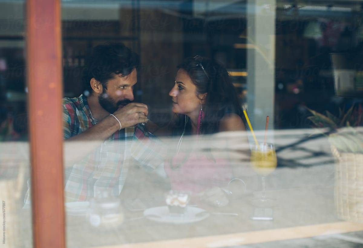 Couple in a Cafe Seen Through the Glass