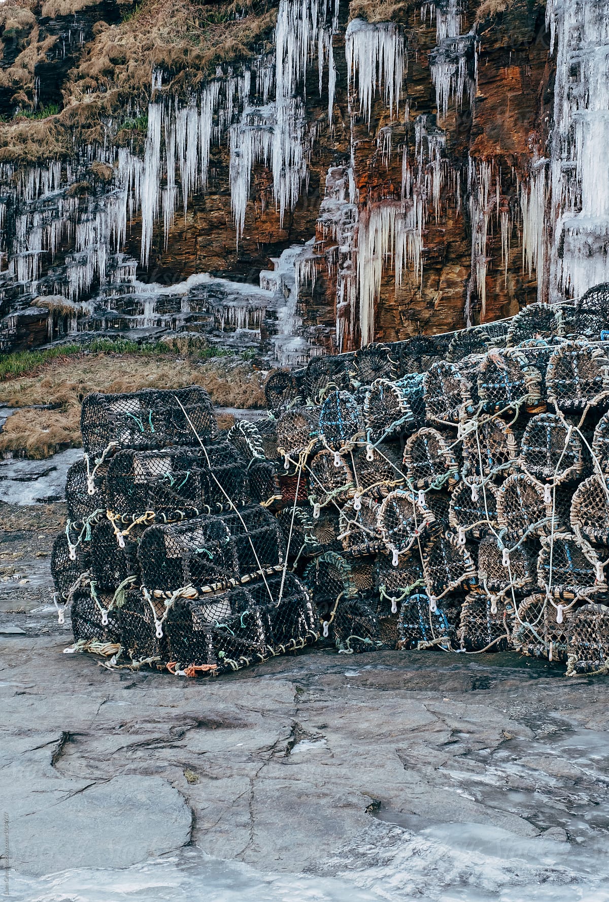 Icicles and lobster pots in the harbour at Boscastle. Cornwall, UK.