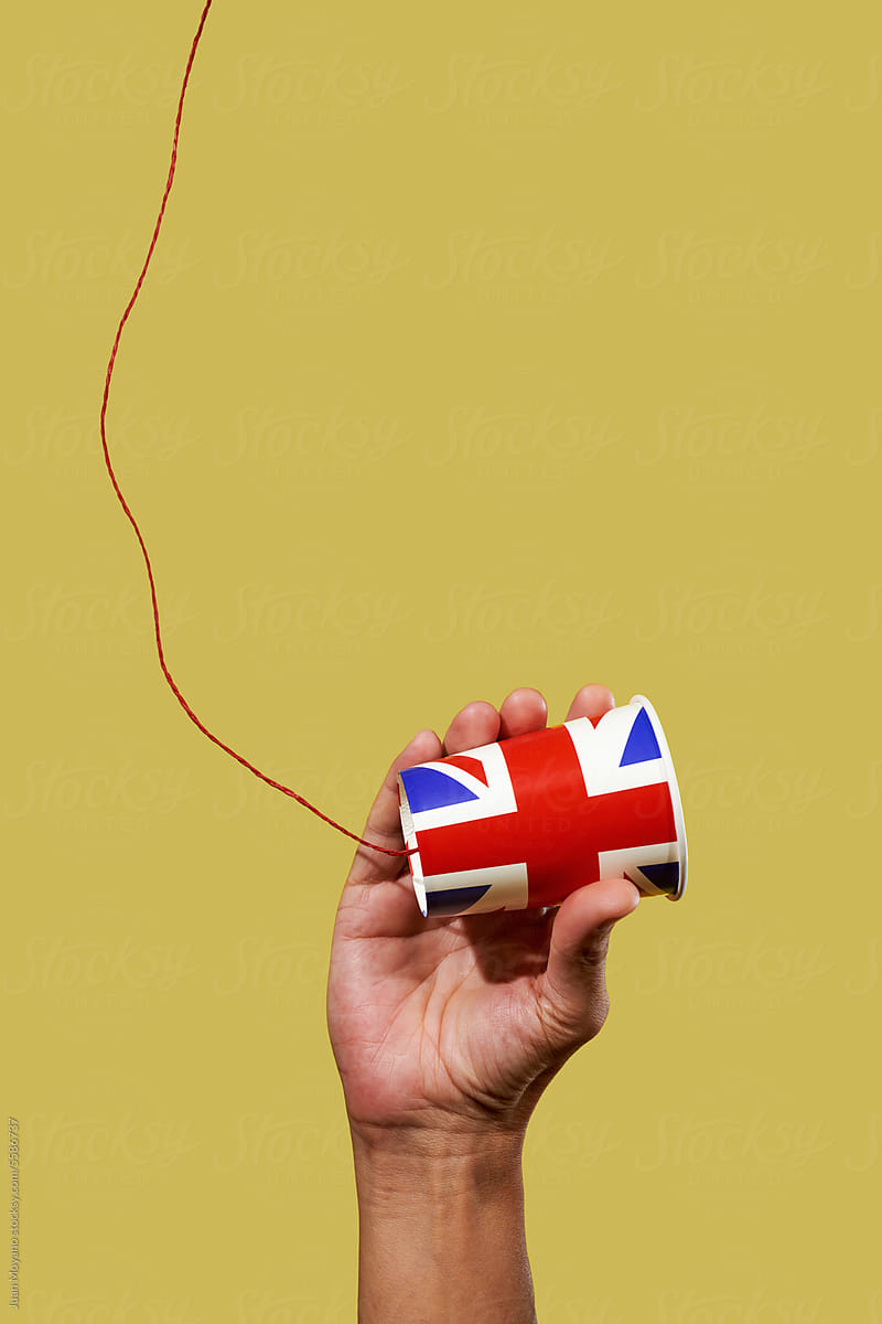 man holding a british string telephone