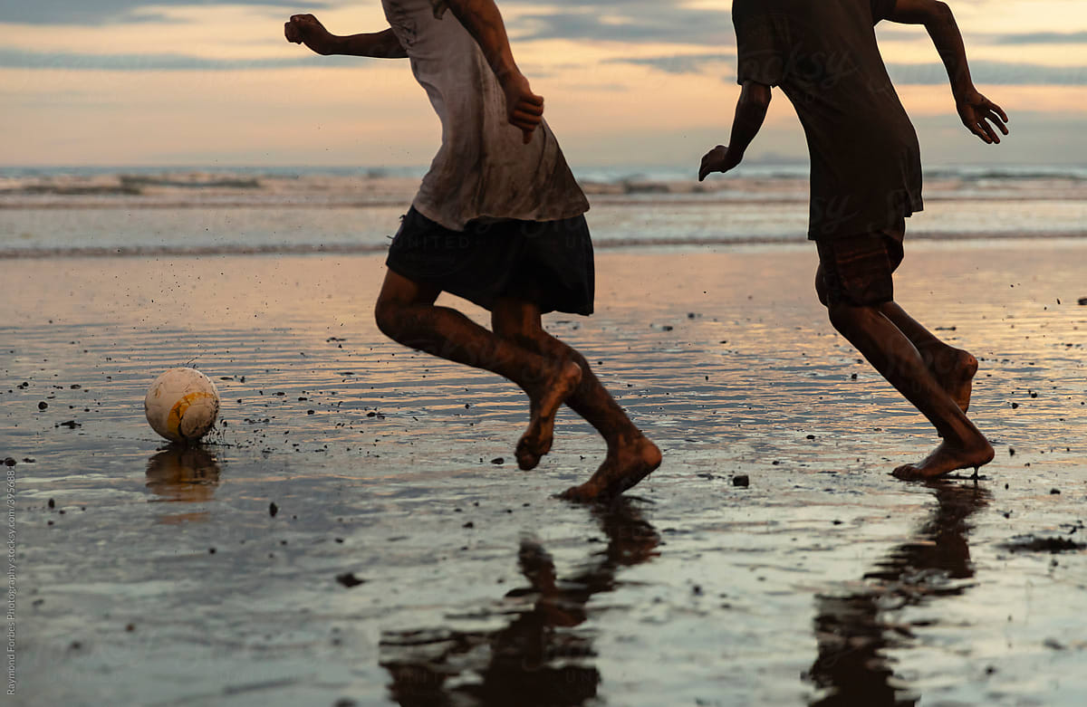 Competitive Soccer game on the beach