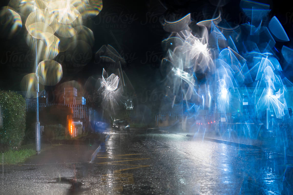 An empty street on rain soaked street at night