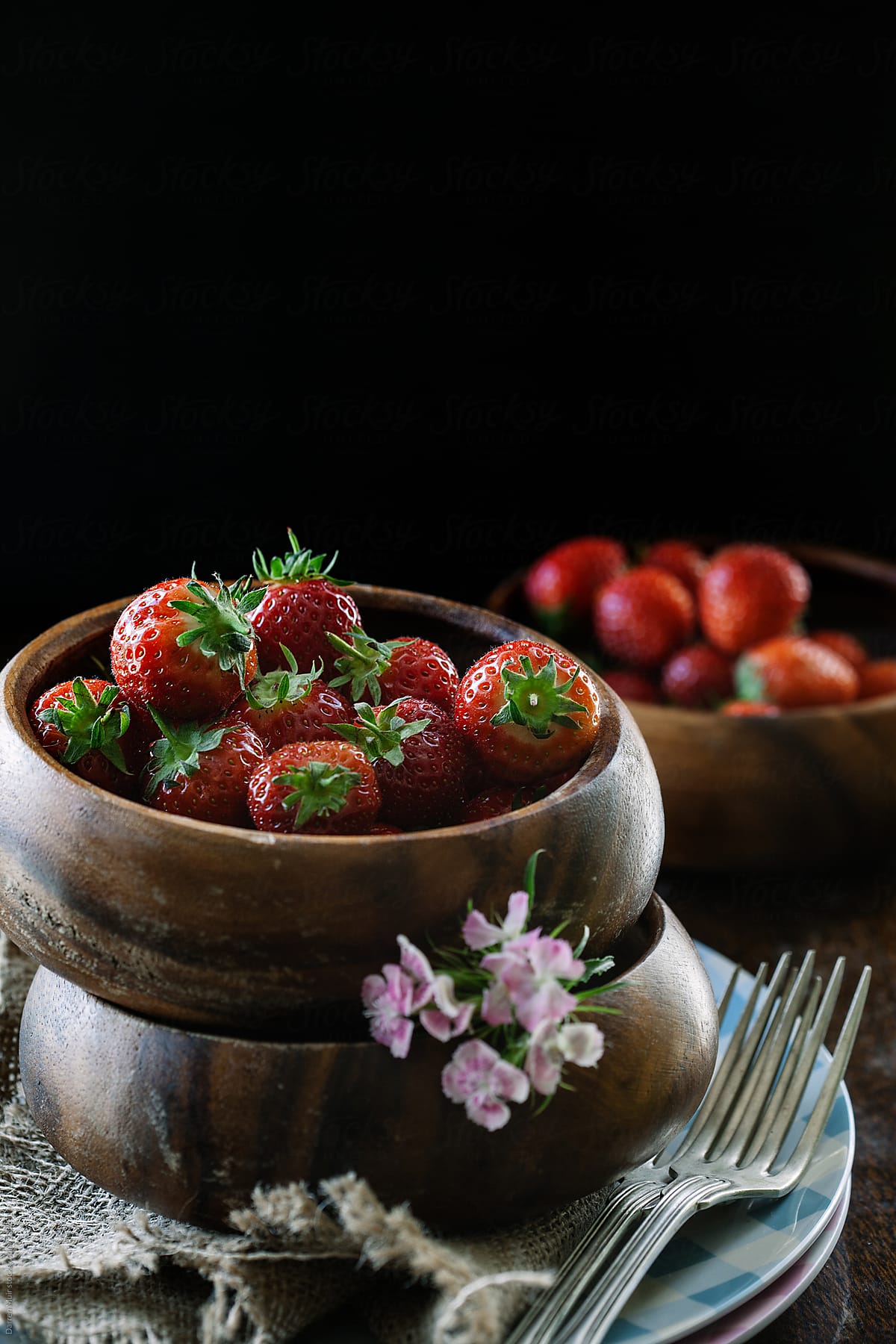 Strawberry\'s in wooden bowls.