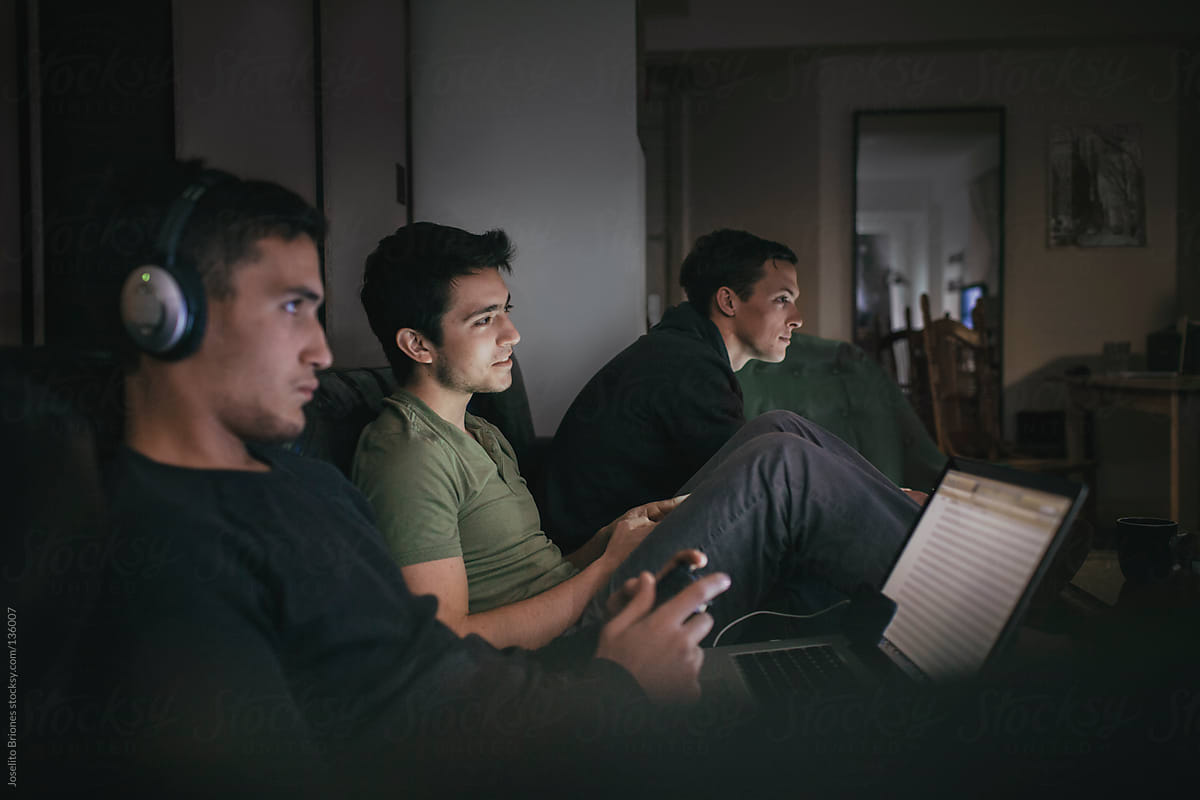 Student Friends and Rommates Playing Video Game and Using Smartphones and Laptop