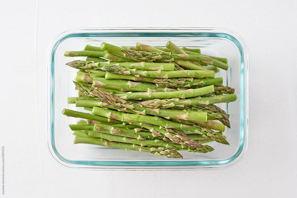 Organic Asparagus Stalks and Tips in a Glass Container