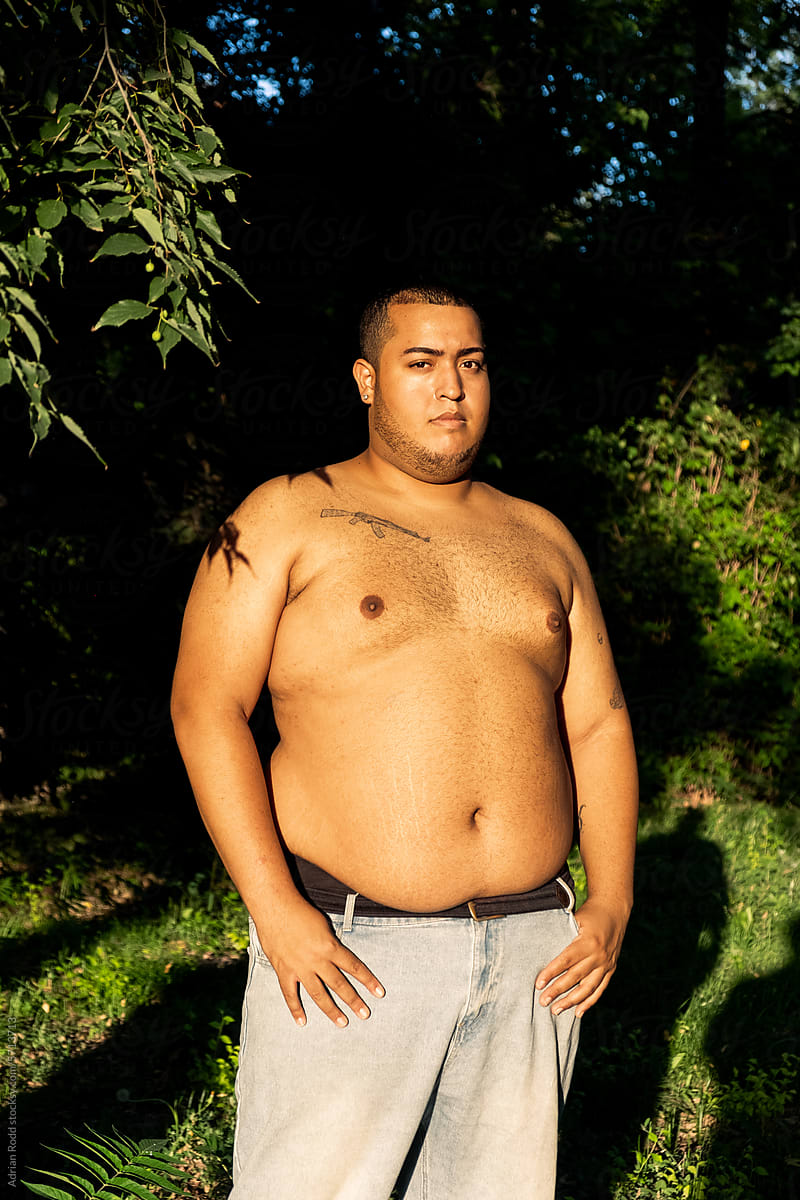 Portrait of a shirtless plus-size black boy