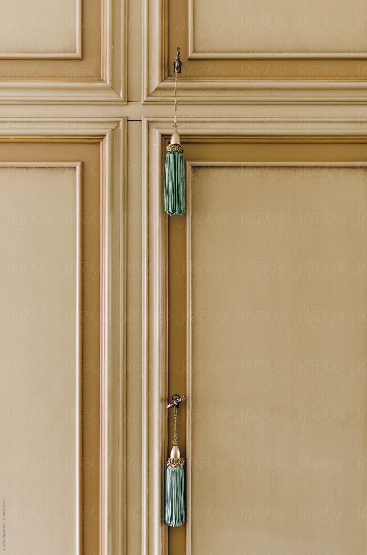Closed cabinet doors with keys and tassels