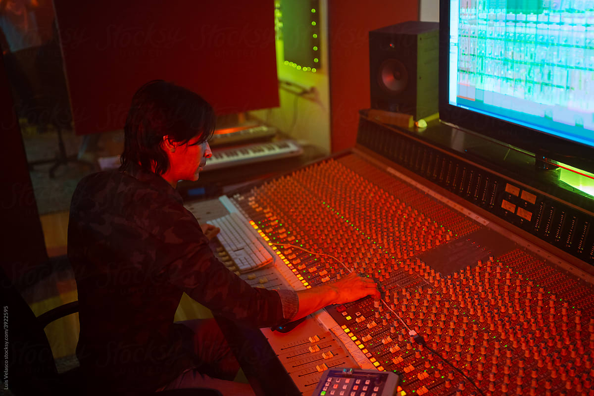 Professional Sound Engineer Working With A Mixer Sound Software.