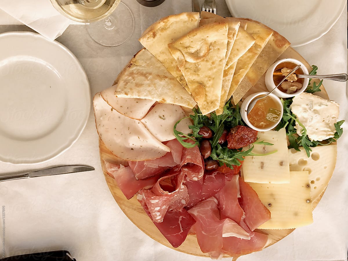 Plate of meats and cheese in cafe, Rome
