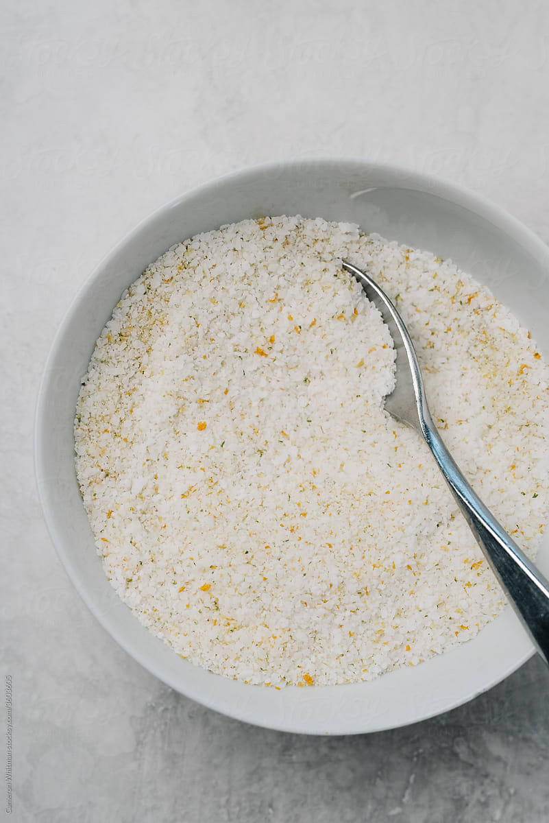 Citrus-infused salt in a white bowl