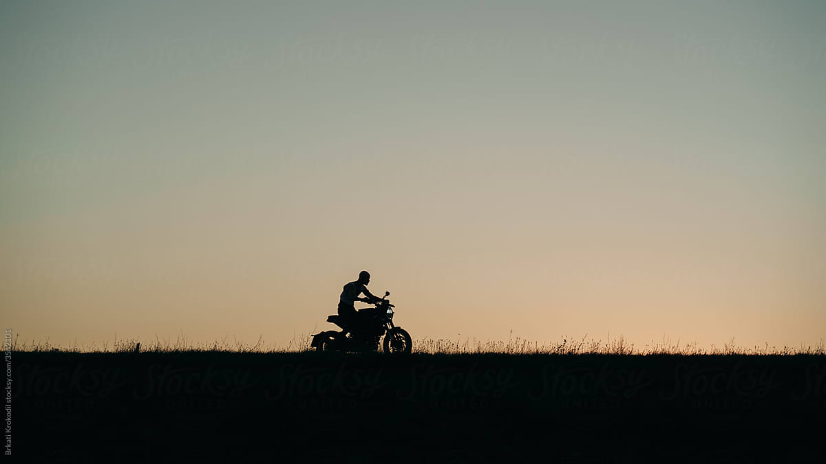 Silhouette Of A Man Riding Motorcycle