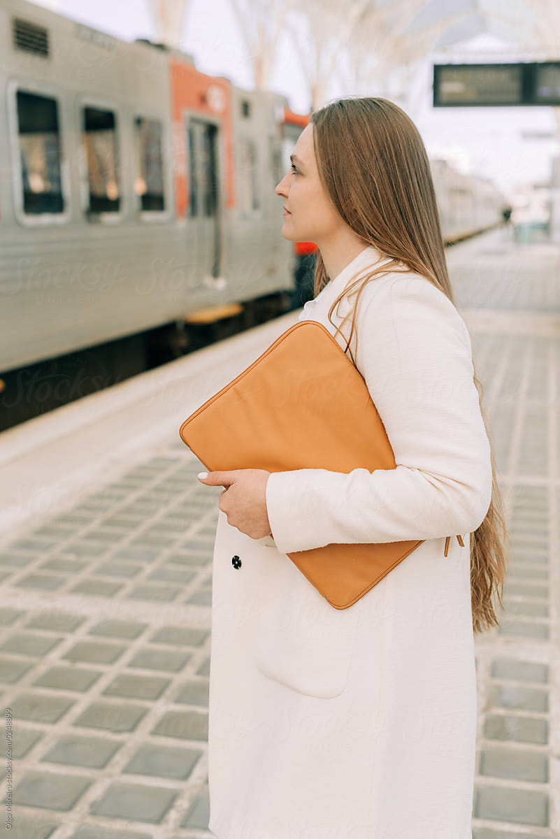 Woman waiting for a train
