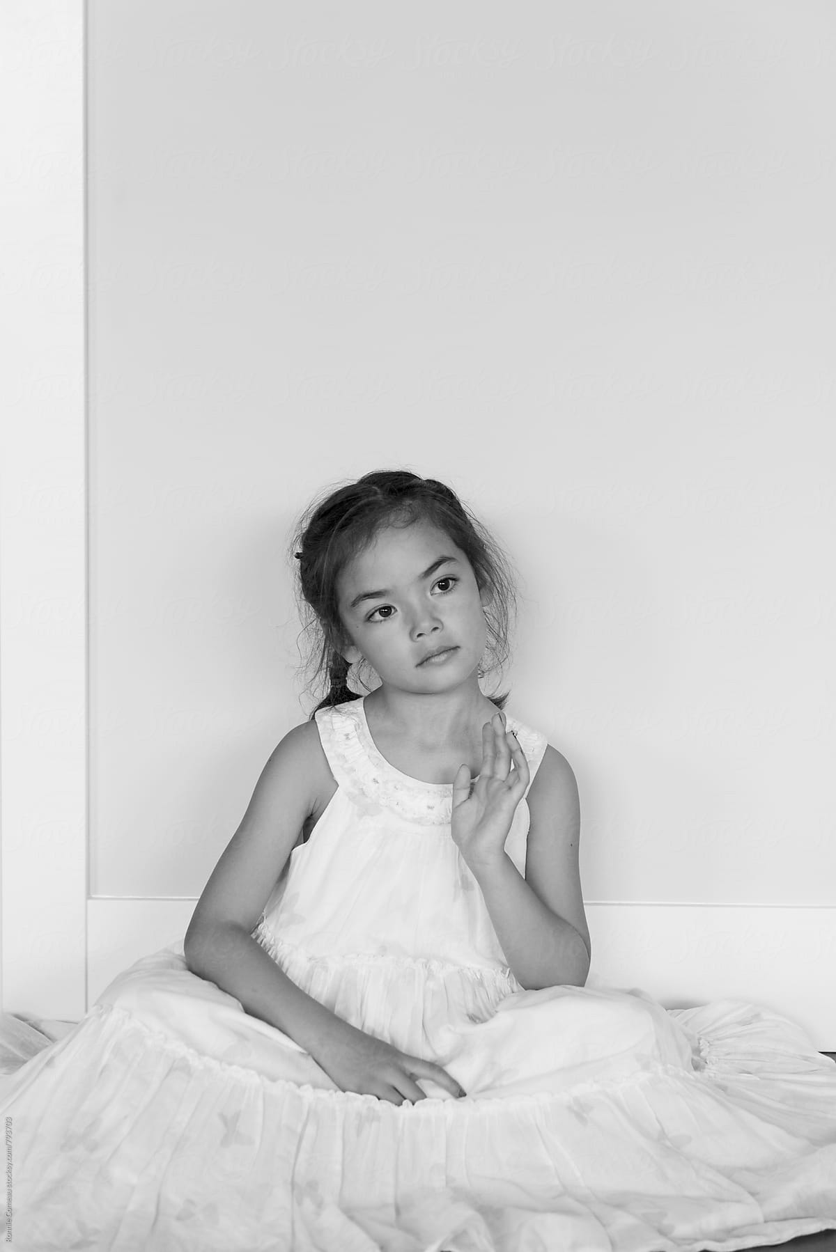 Little Girl In White Dress At Home