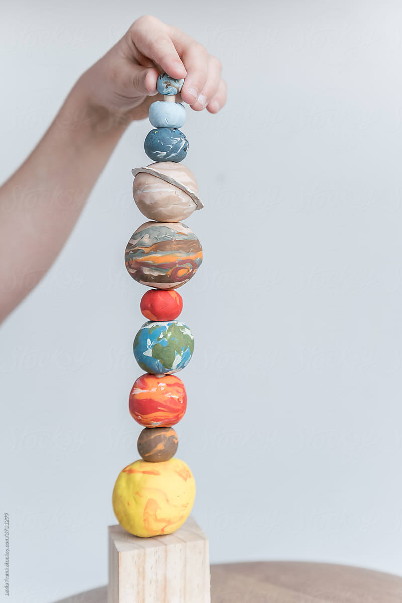 space planet stacking toy with hand