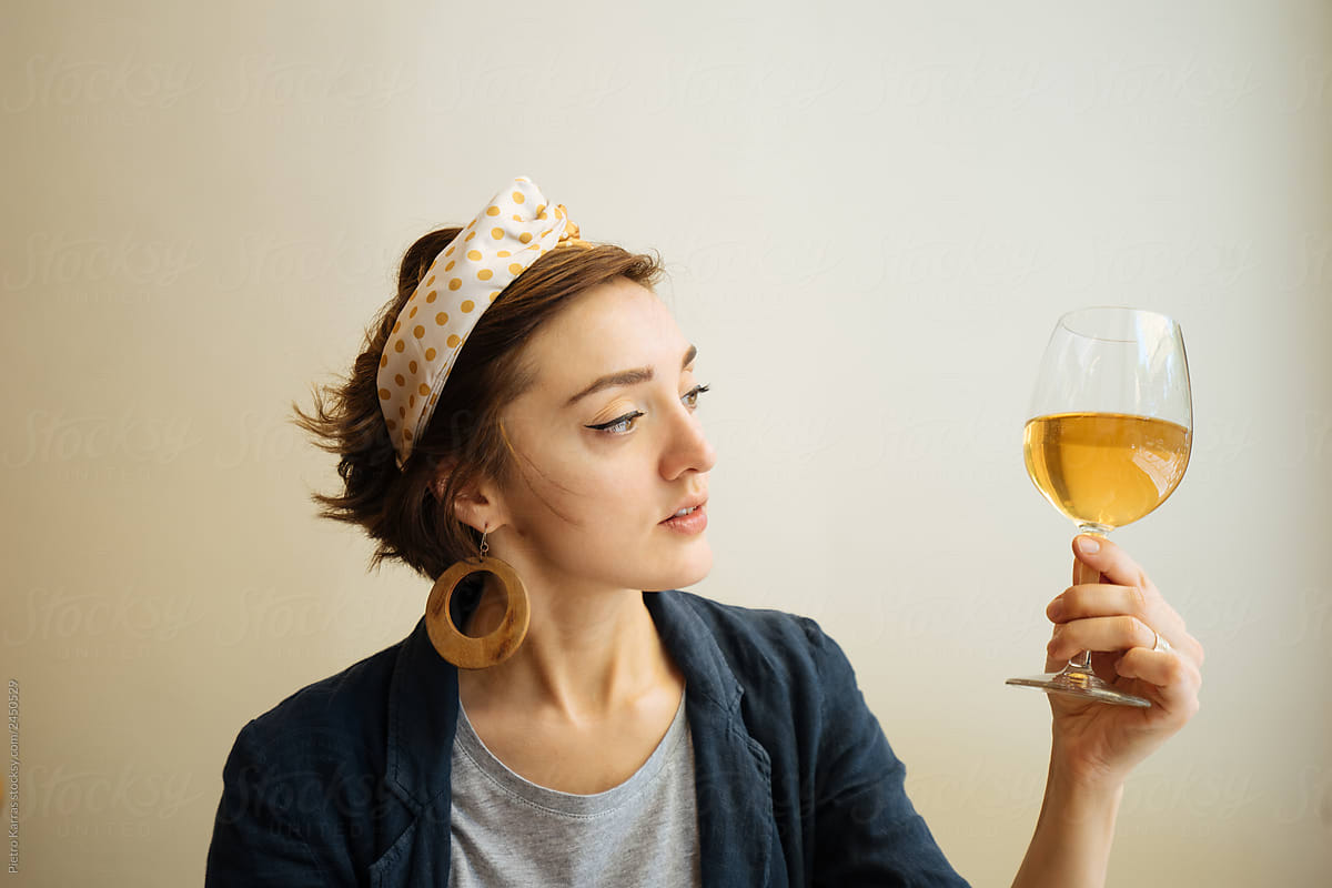 Young woman looking at wine