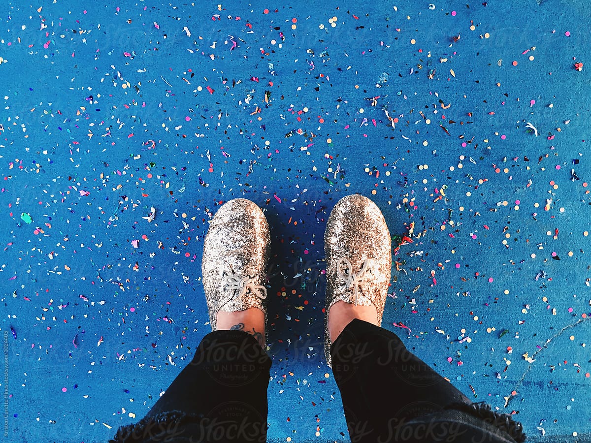 First Person View Of Someone Looking Down At Their Shoes And Confetti