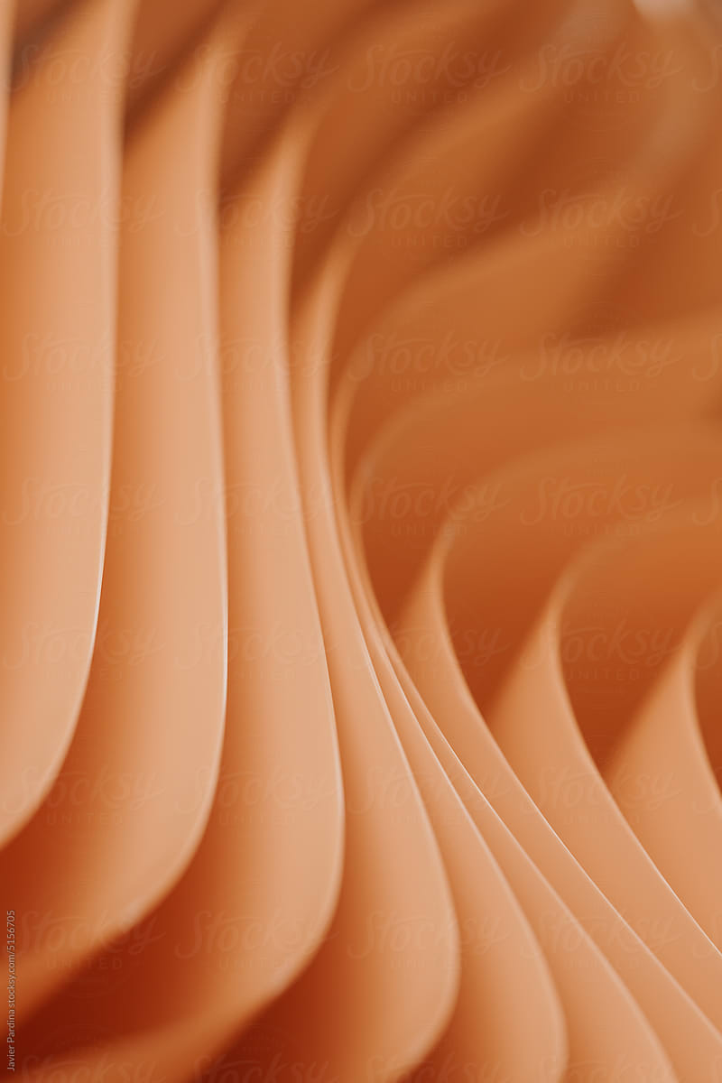 Abstract orange background with layers of silk folded drapery