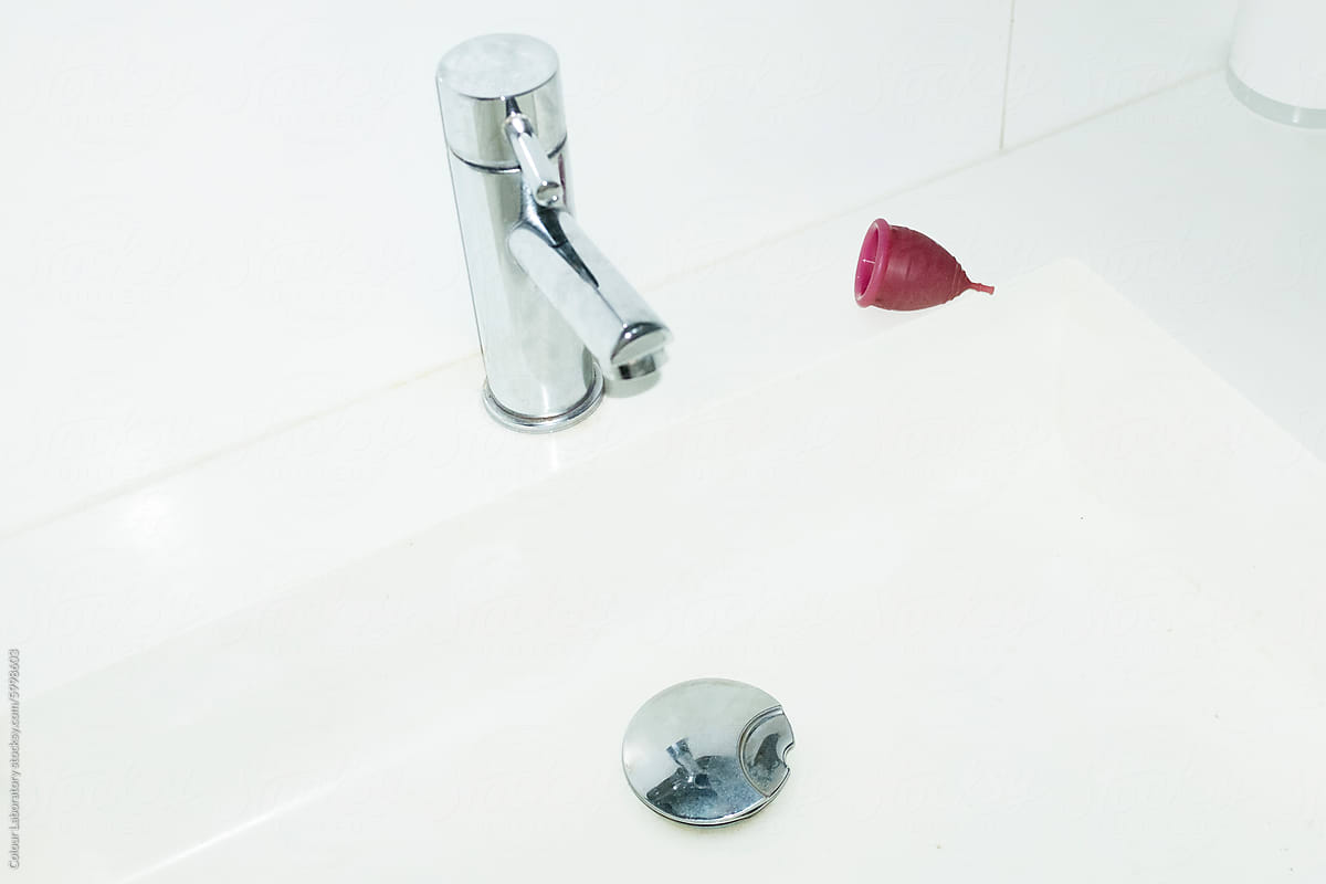 Contemporary photo of period / menstrual cup and toilet sink