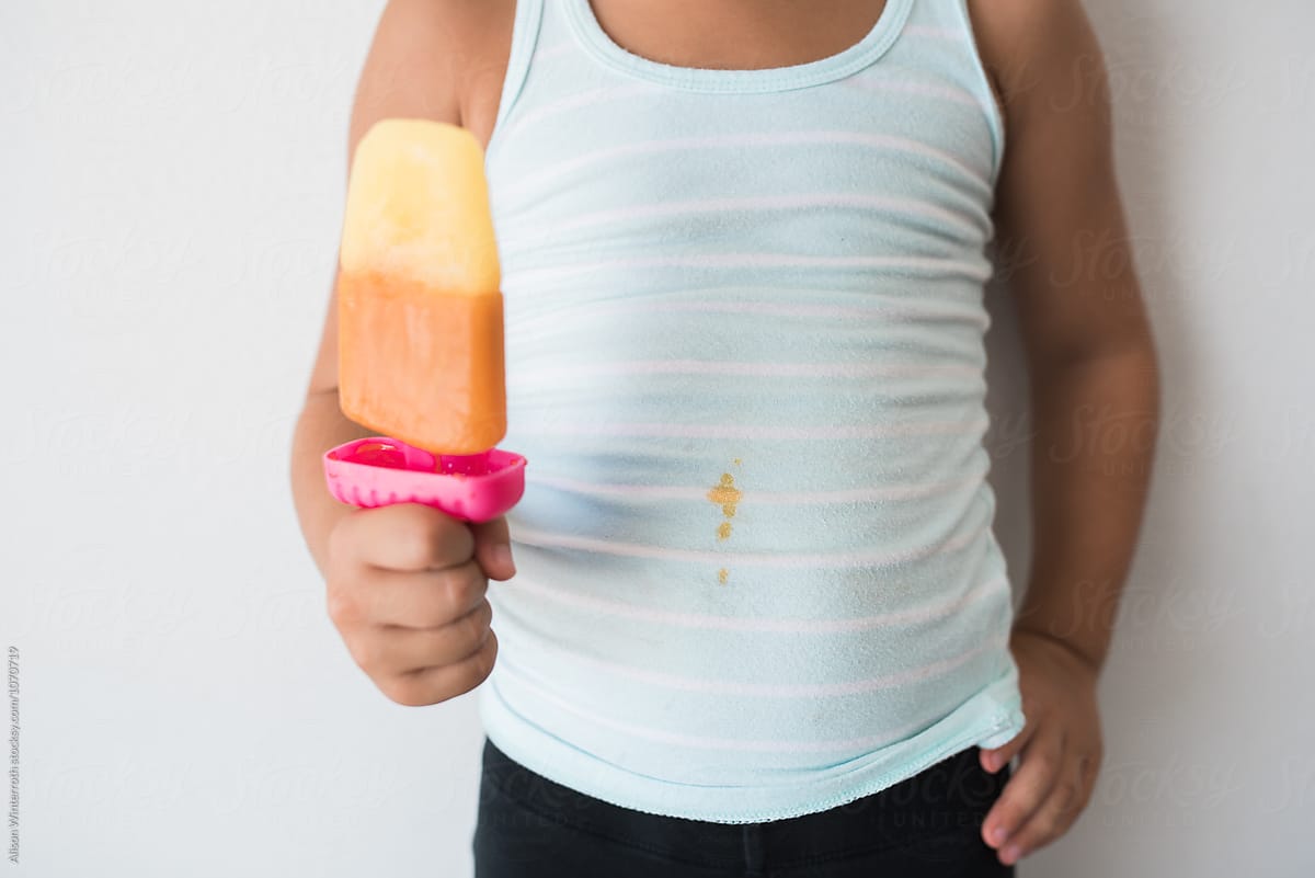 A Child With A Stain On Her Shirt From A Popsicle