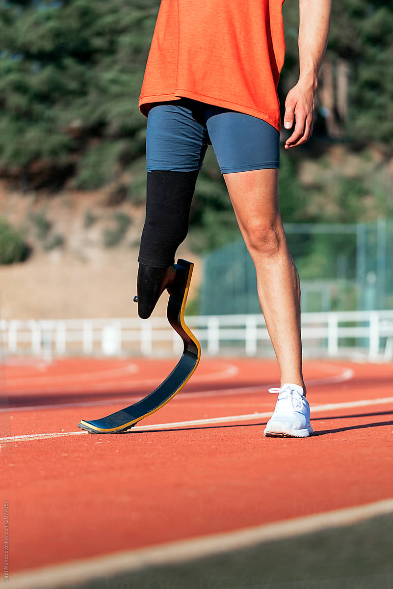 Close up disabled man athlete with leg prosthesis.
