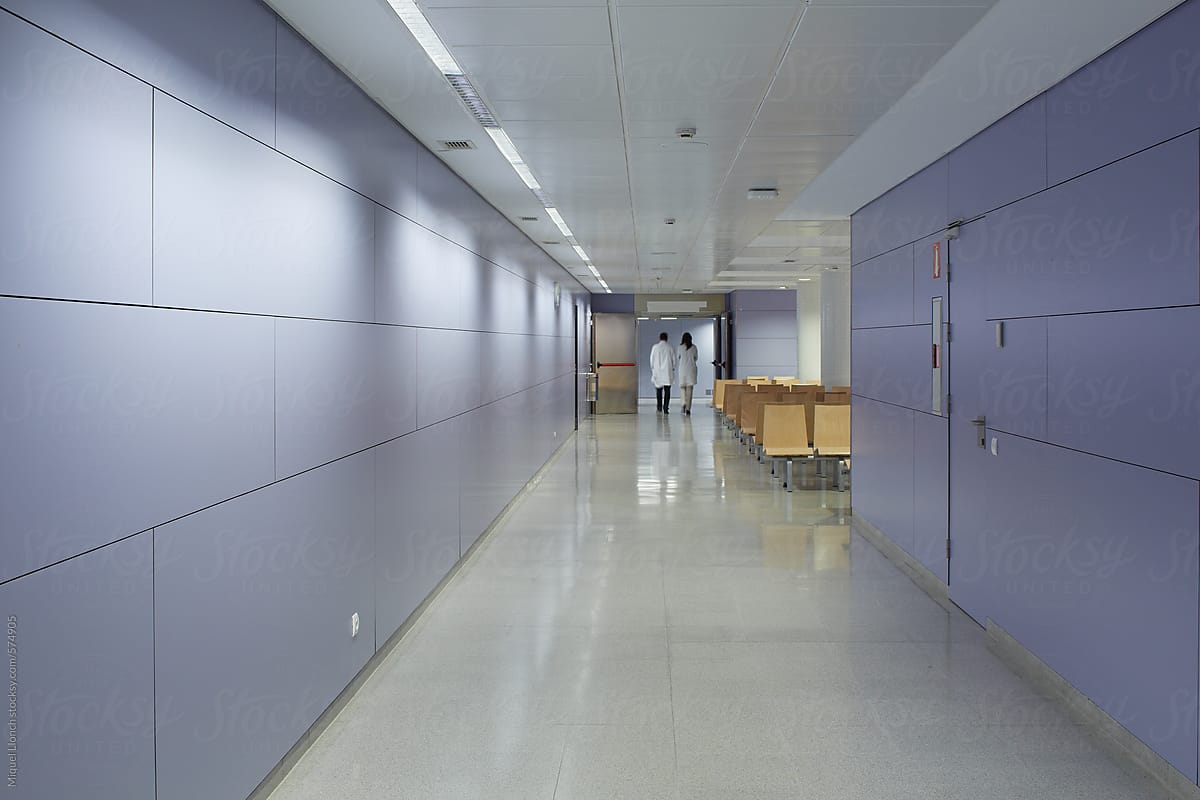 Hospital hall with silhouette of two doctors