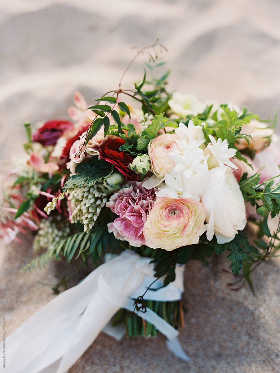 gorgeous luxury floral wedding bouquet with red and peach
