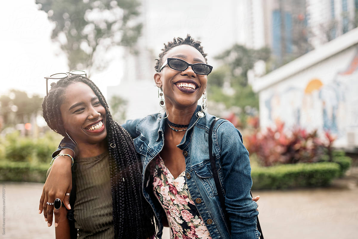 Young afro women laughing together