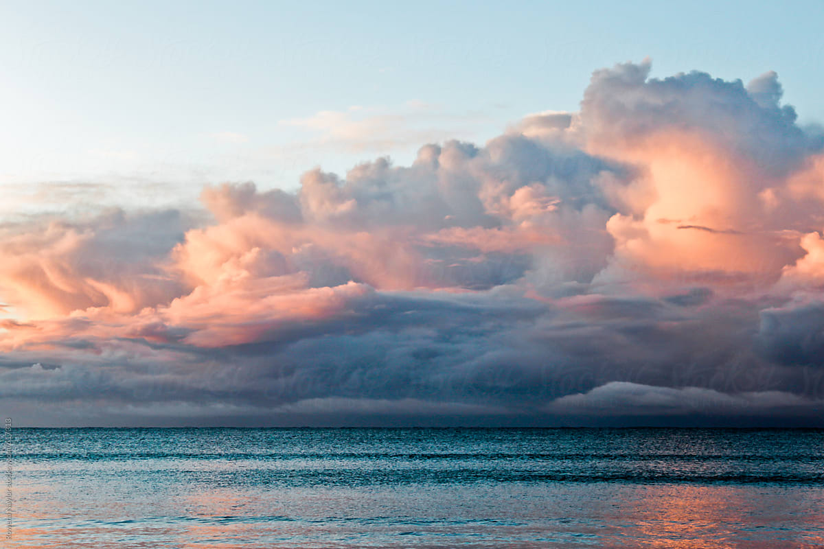 Storm Clouds Developing At Sunrise Over Ocean By Rowena Naylor