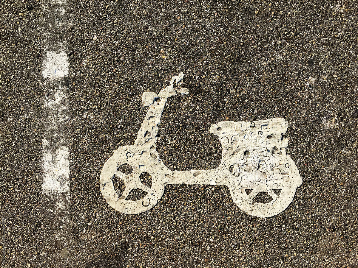 icon of moped on road