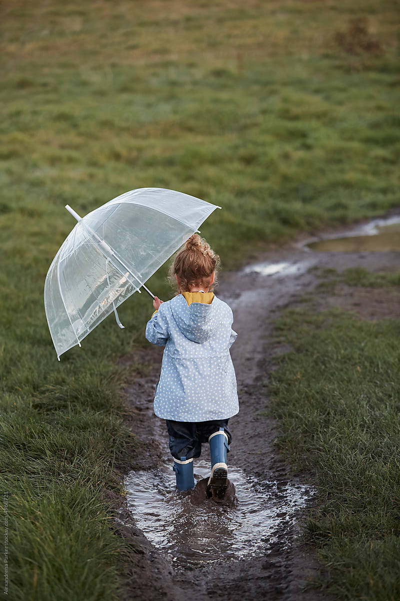 Little girl on a walk with her umbrella.