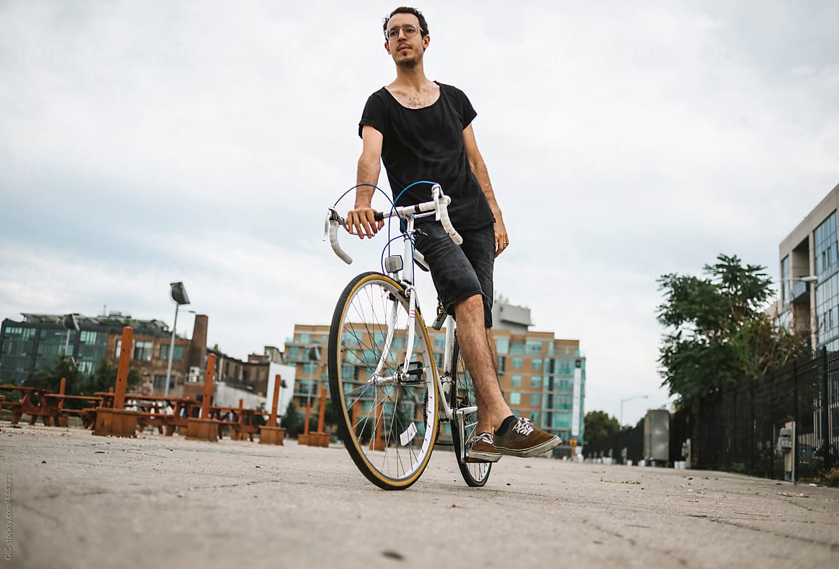 Man riding a bicycle in urban area