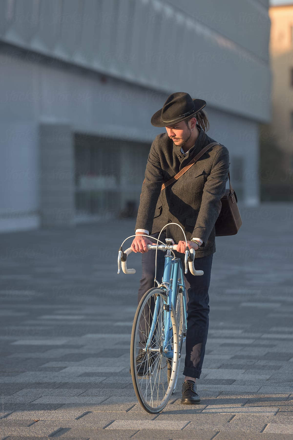 Full-length portrait of man riding city bicycle
