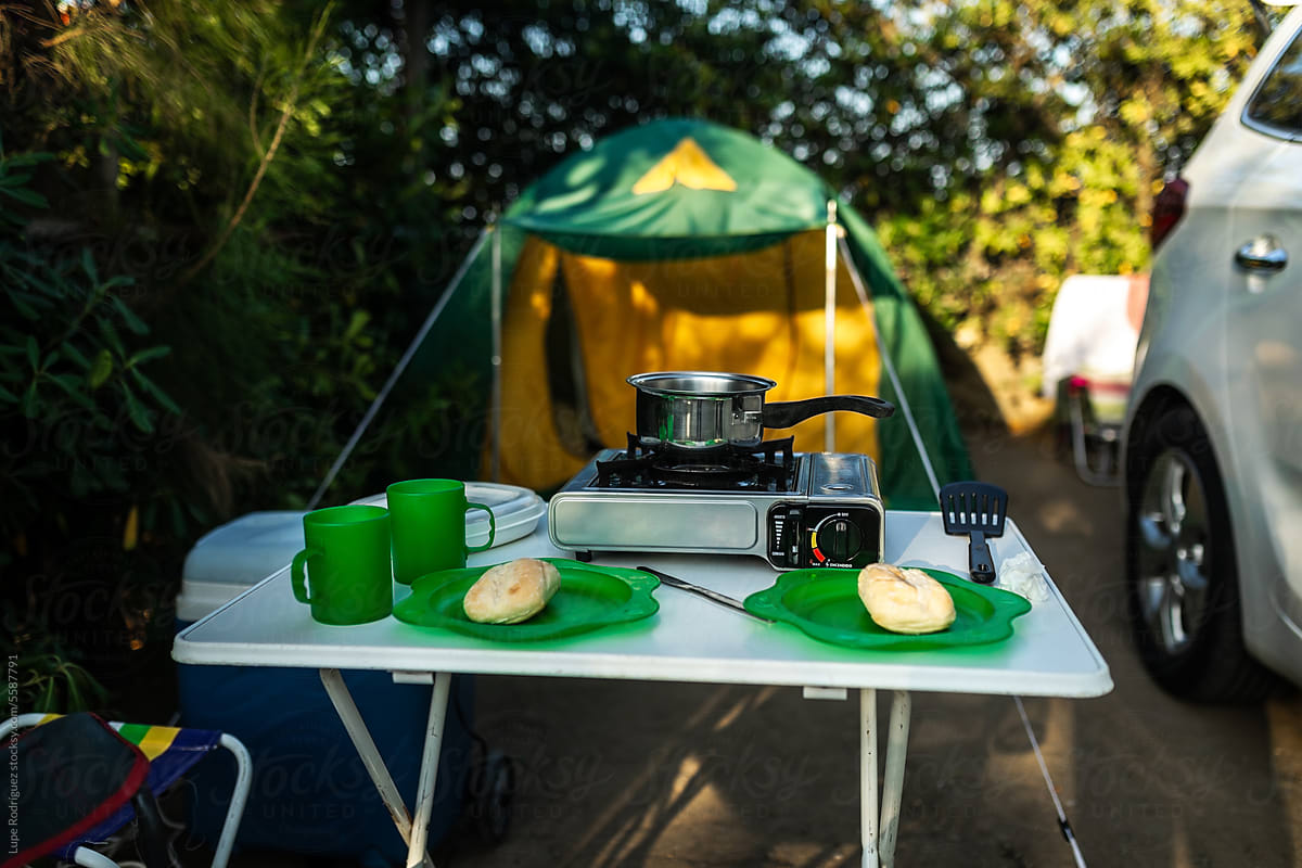 table set in a campsite next to a tent
