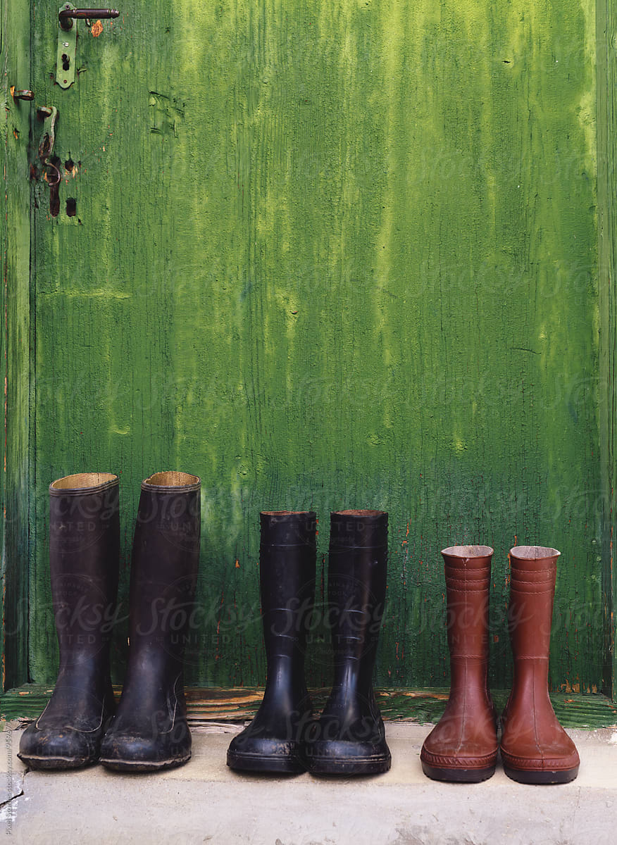 Rubber Welington boots on doorway