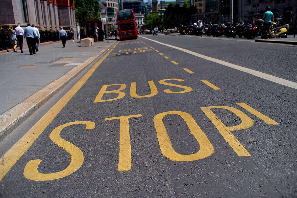 BUS STOP asphalt sign