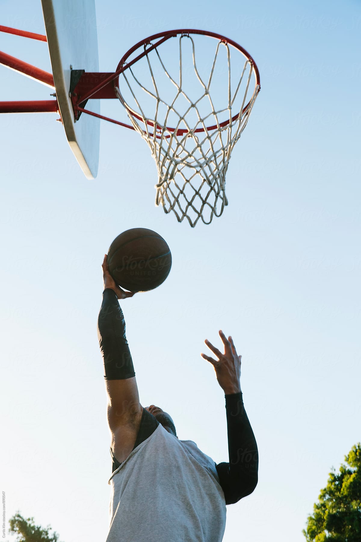 Basketball player in the air for a layup