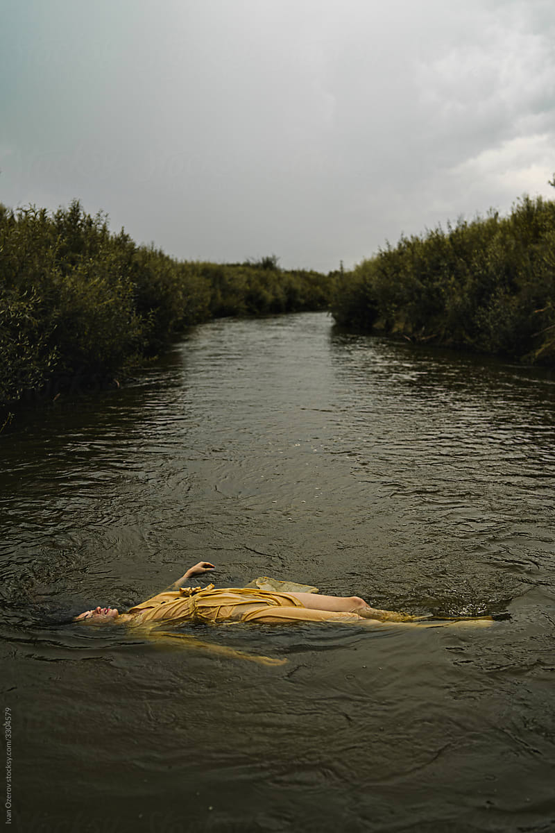 the body of a young beautiful girl floats on the river