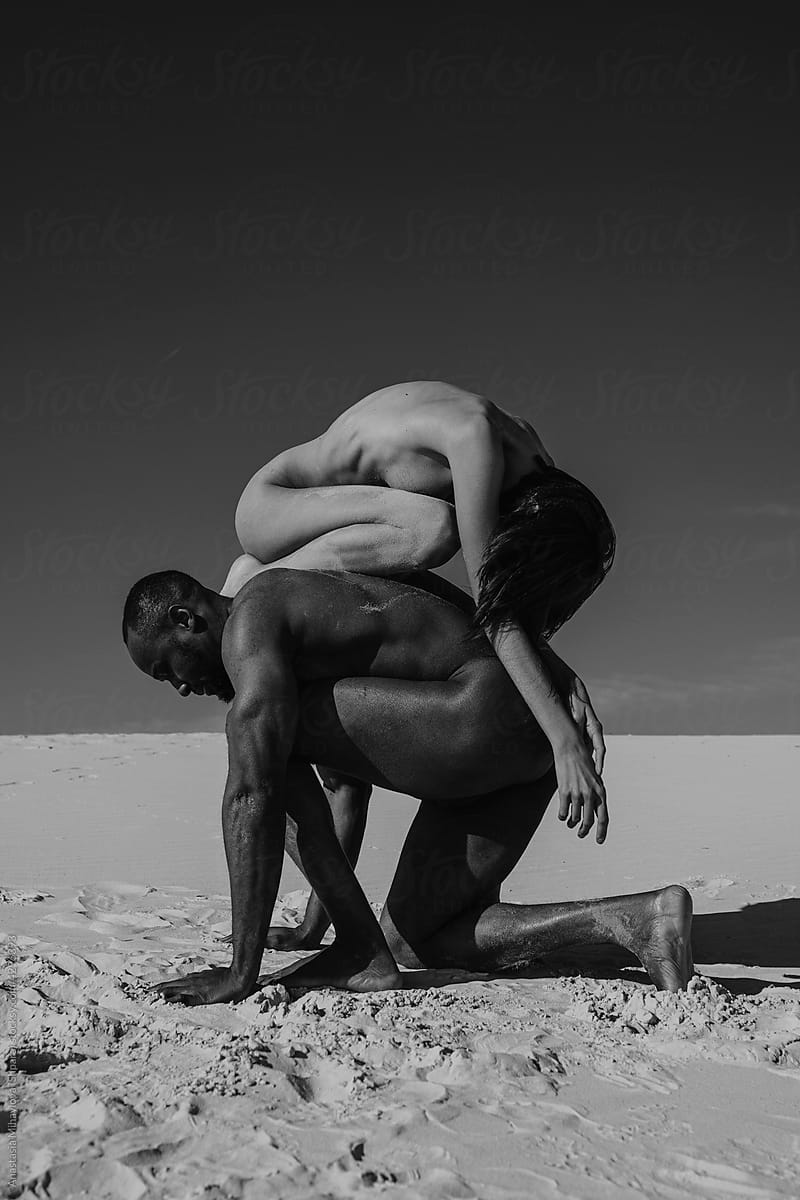 Love story of Nude couple in the desert monochrome
