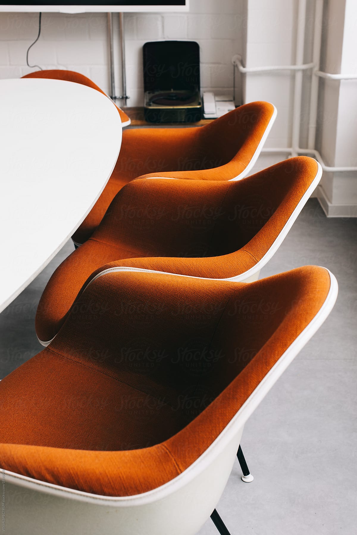 Retro 1970s Designer Chairs In Bright Conference Room By