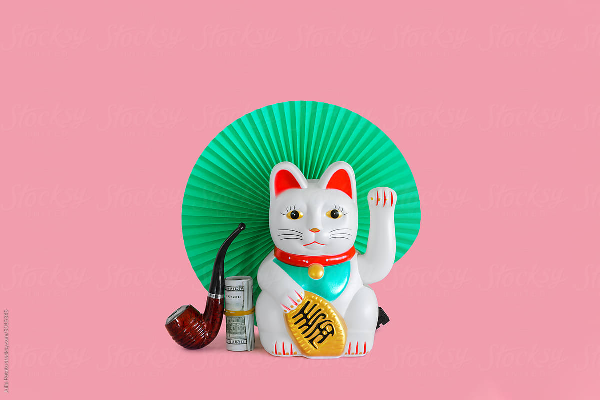 Chinese lucky waving cat with money and paper fan