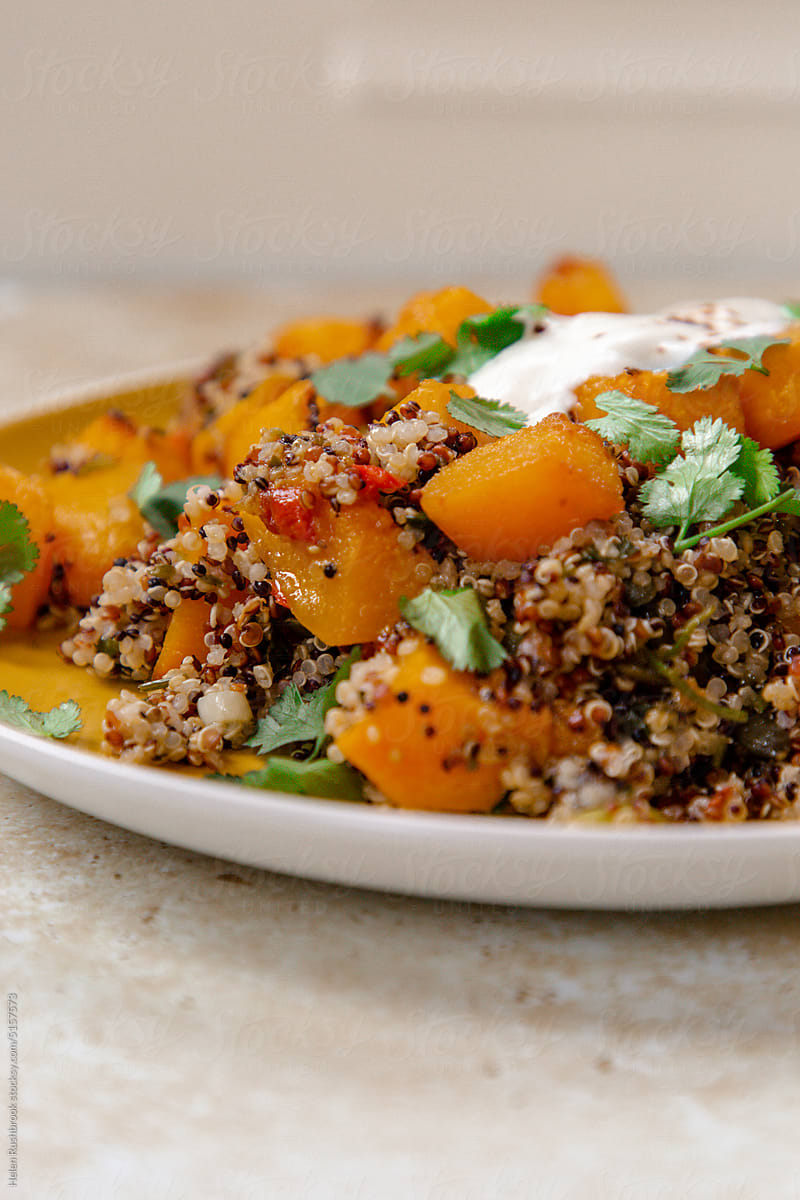 Healthy vegetarian warm salad of pumpkin and quinoa.