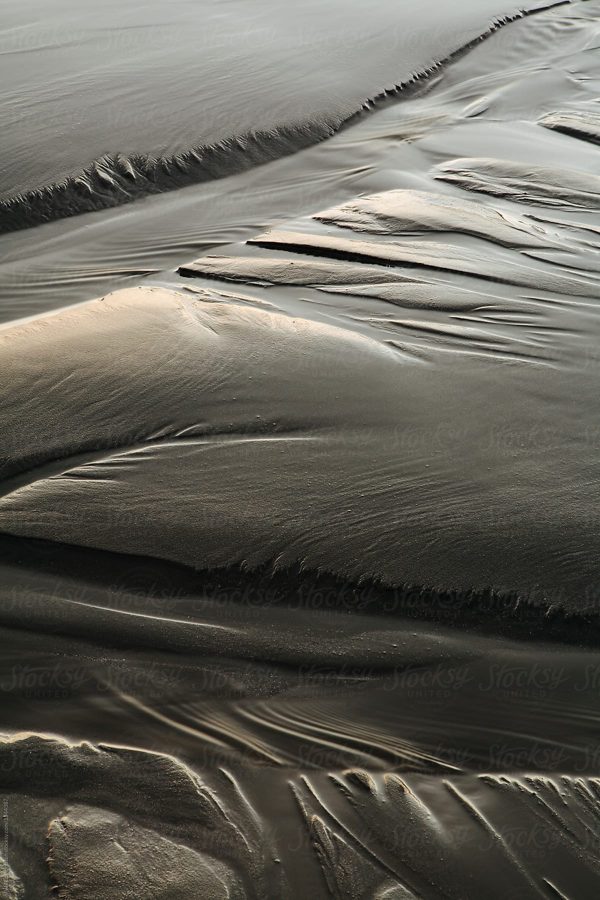 Close up of patterns in sand at low tide
