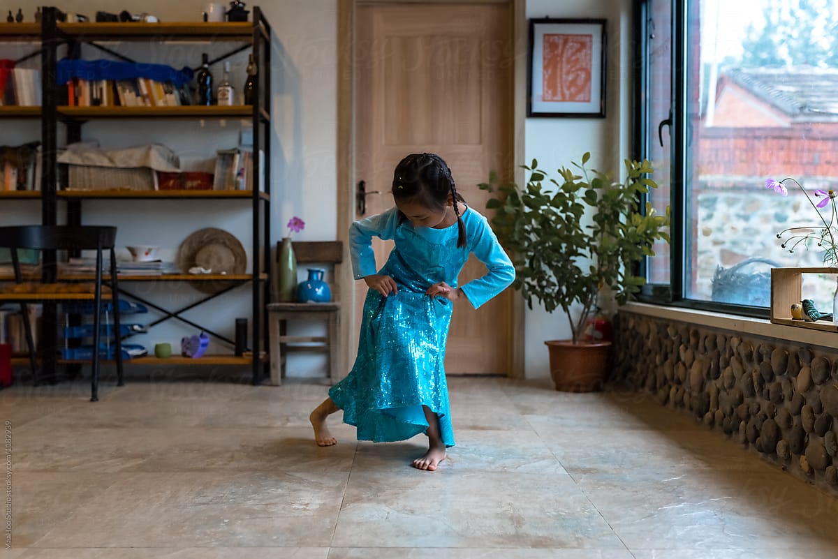 Young girl dancing at home