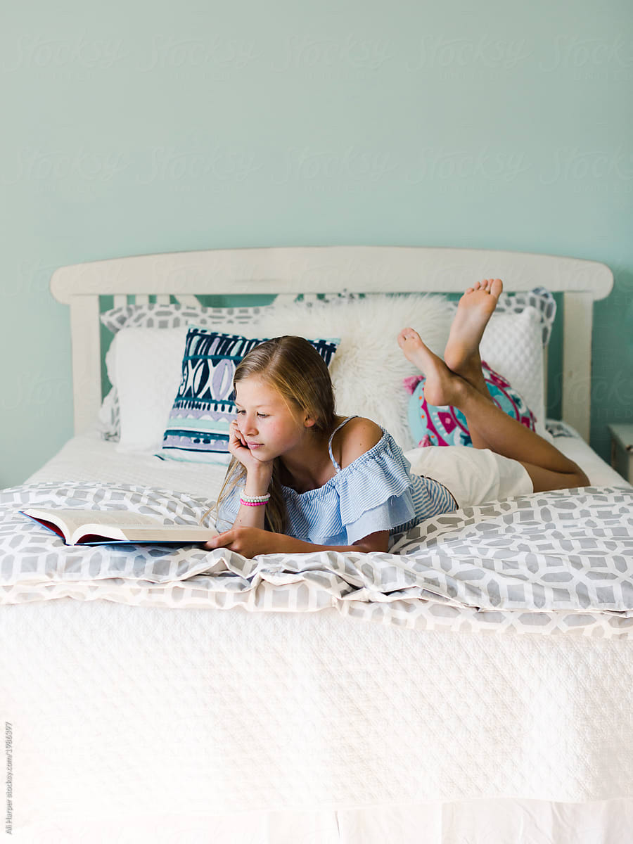 Young Girl Reading On Her Bed By Stocksy Contributor Ali Harper Stocksy 