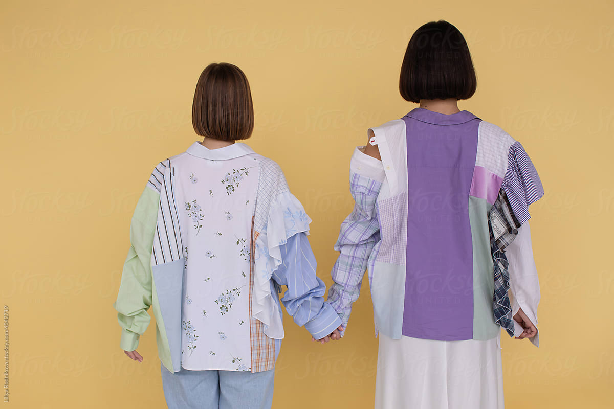 Two unrecognizable models in patchwork clothes - ethical fashion