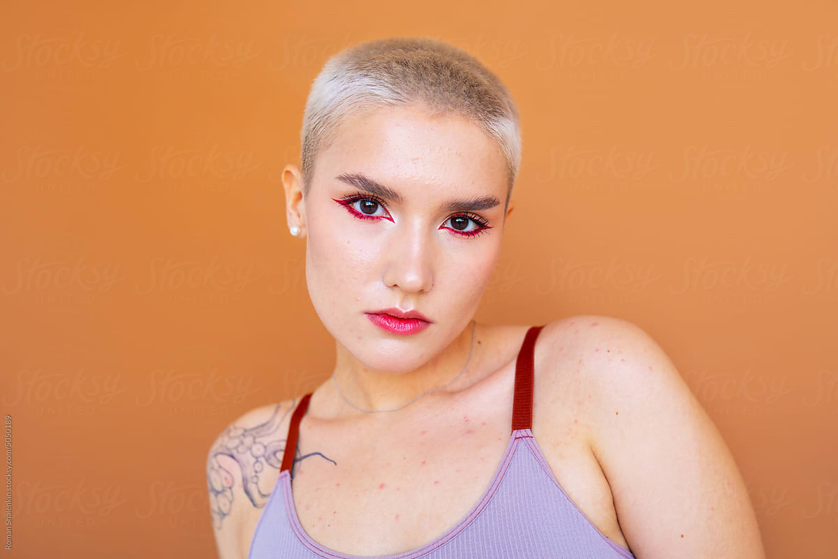 Young androgynous model with short blond hair