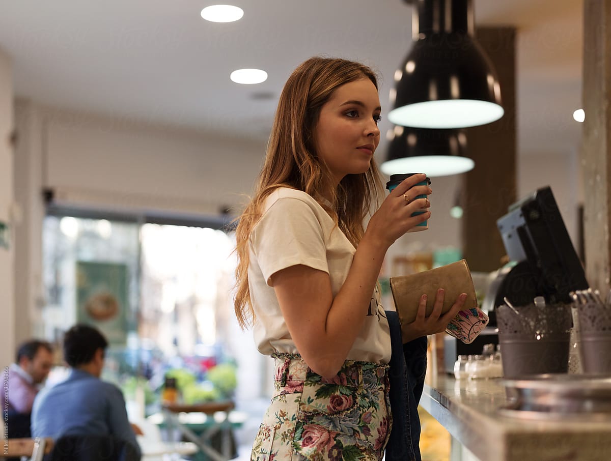 Casual woman with coffee waiting for order