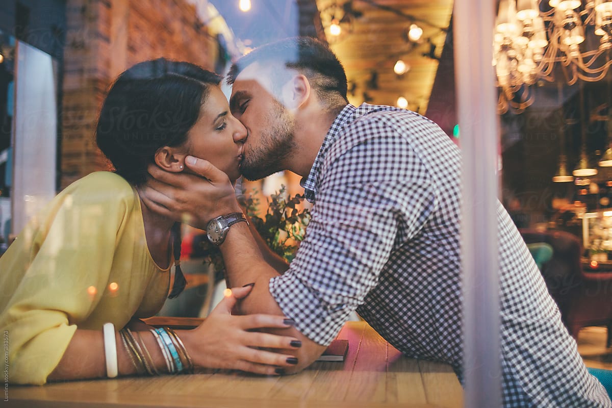 Couple In Love Kissing At A Cafe By Stocksy Contributor Lumina Stocksy 