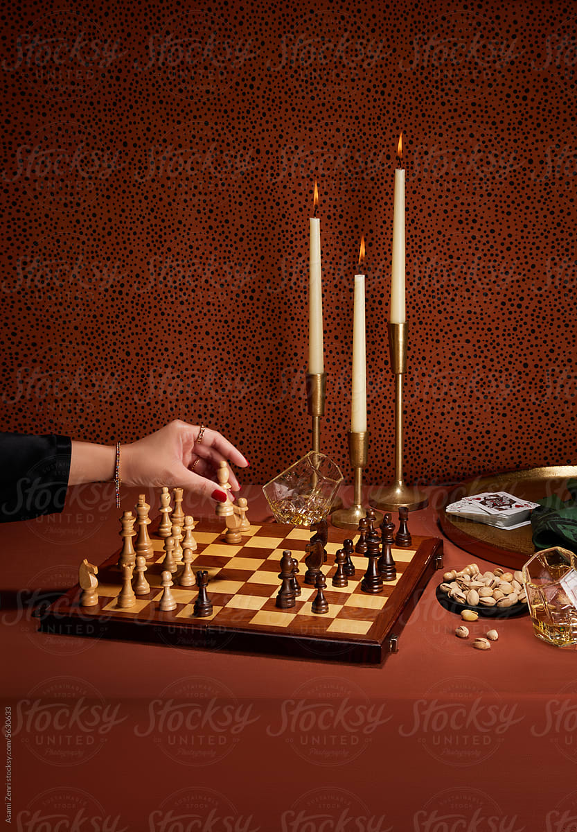 Chess board and woman's hand