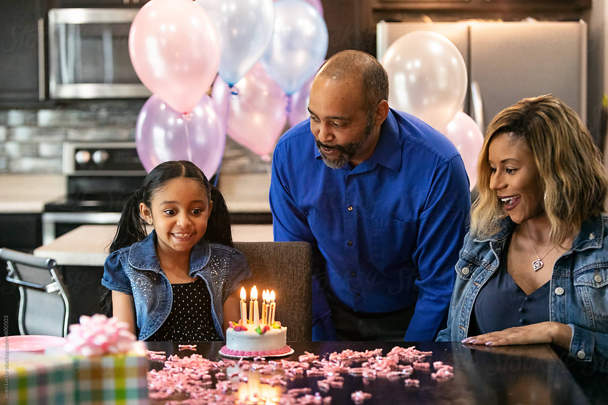 Young Girl Celebrates Birthday With Family